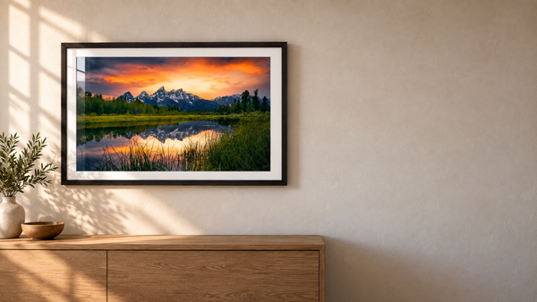 Tetons Ablaze framed landscape photograph displayed in a black frame on a warm interior wall